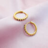 Thin golden layered plated black stone huggie hoops